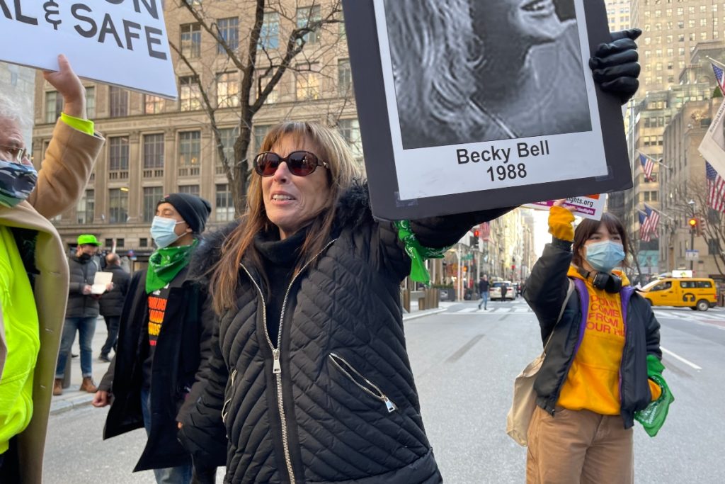 Merle Hoffman holds up a photo of Becky Bell killed by an illegal abortion on Feb. 27, 2022.